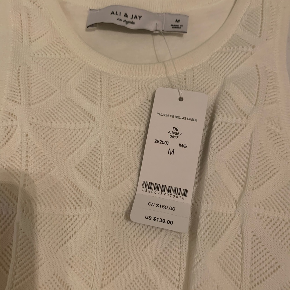DRESS IS WHITE - Picture 2 of 3
